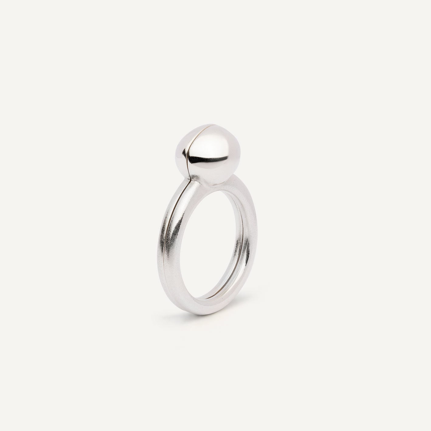 Silver signet ring with gemstones in 2 halves of the ring.