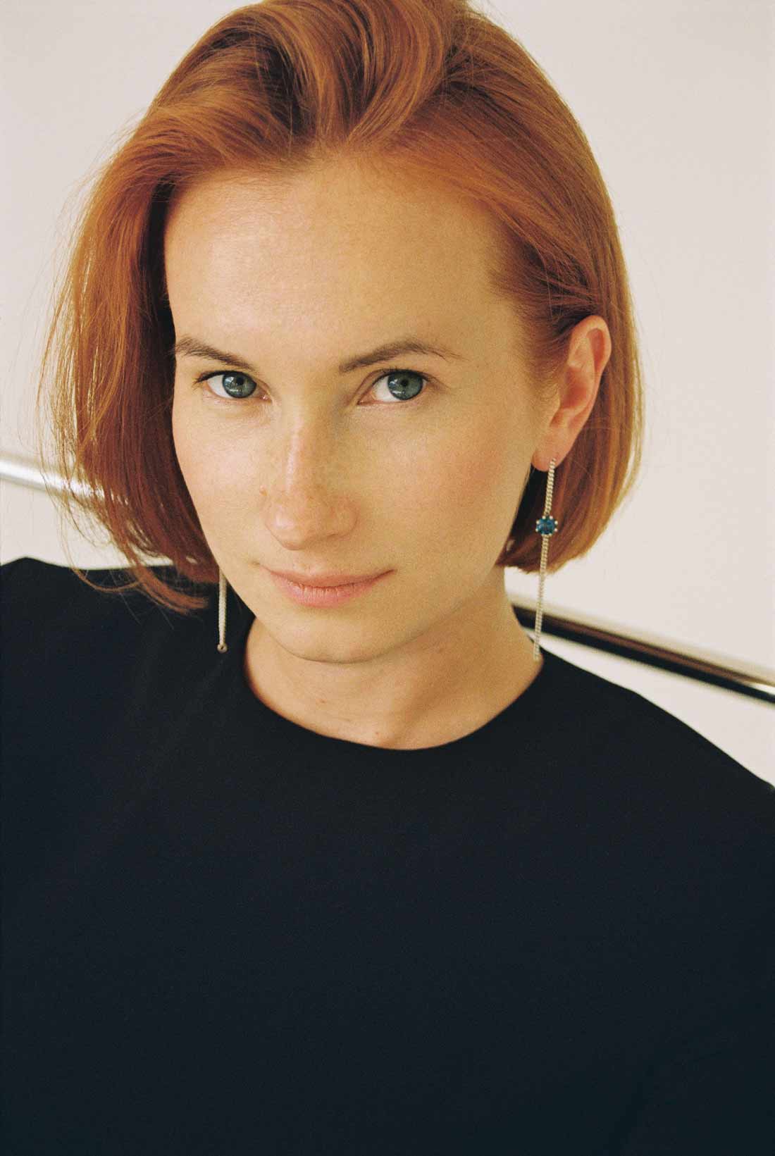 A pair of long chain earrings of colored gemstone made of silver. Handmade in Barcelona.