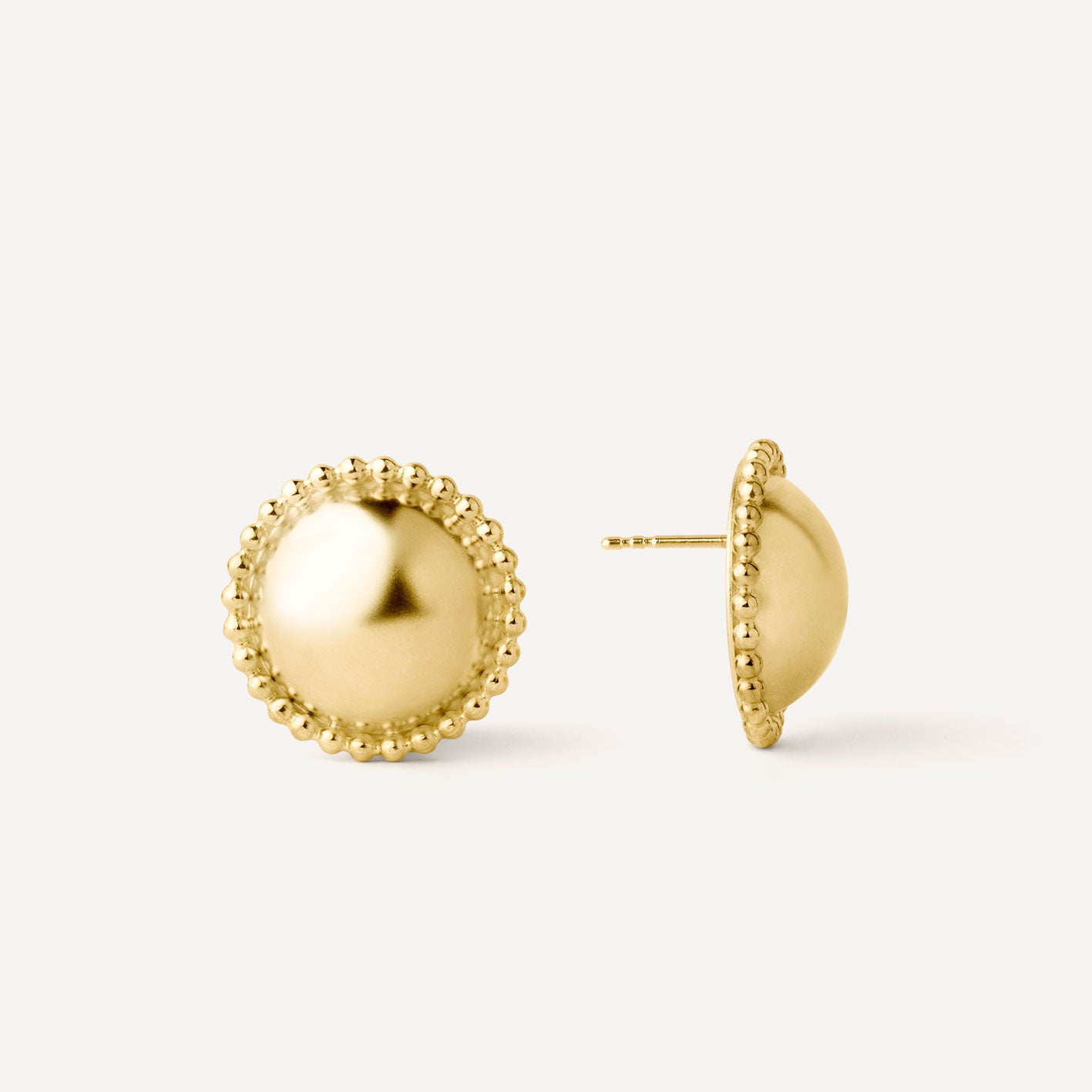 Gold plated silver half-sphere earrings designed to be worn every day. Handmade in Barcelona.