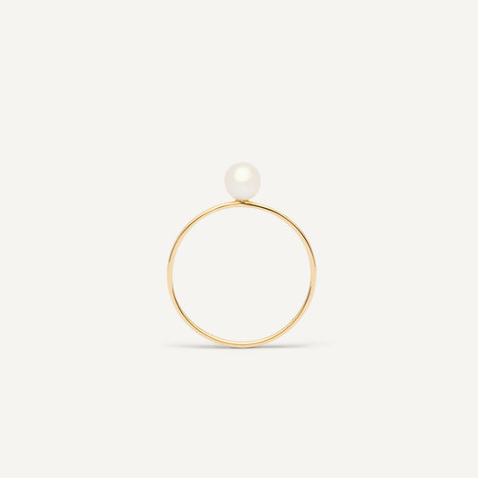Thin gold pinkie ring featuring a white small pearl designed for everyday wear.  