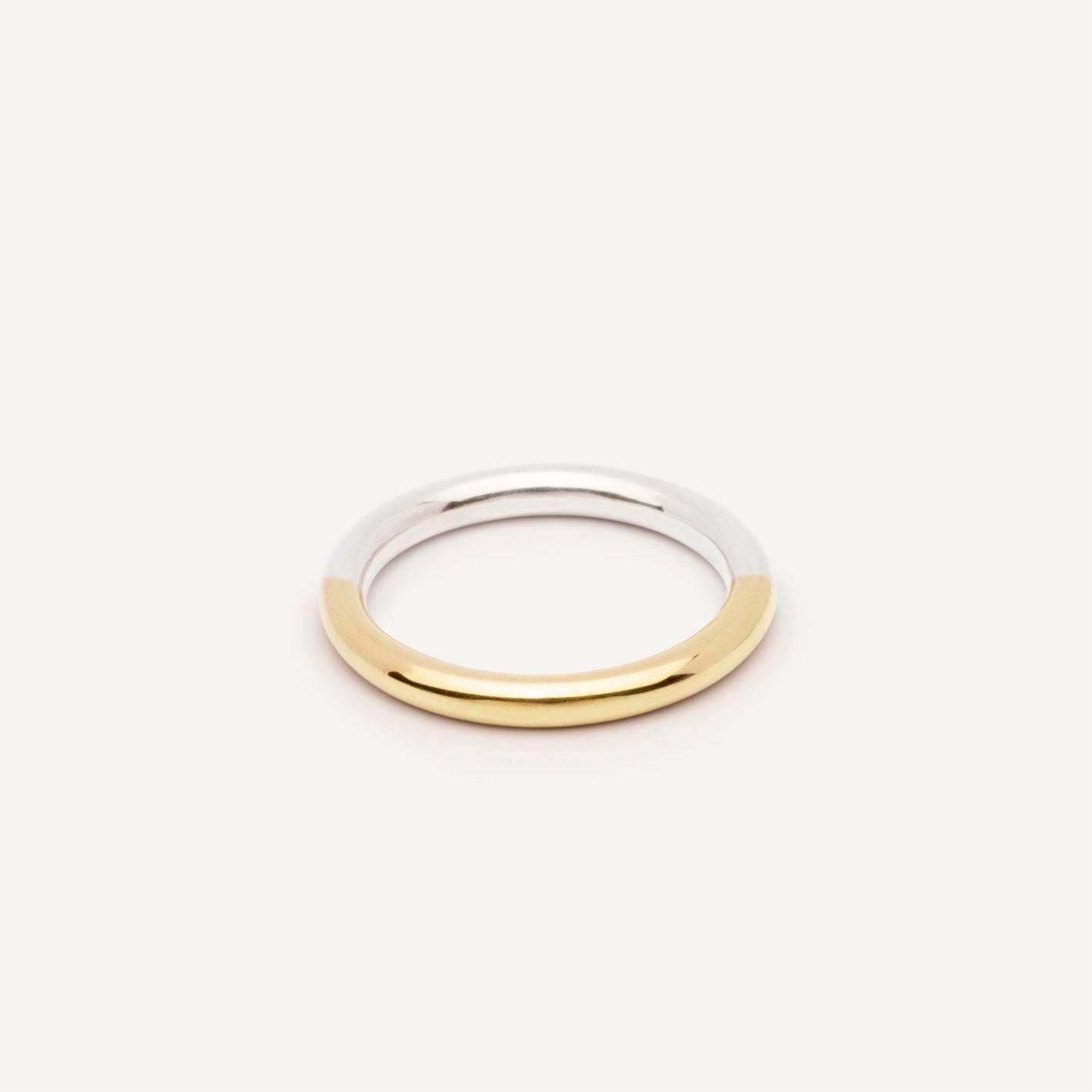 A wedding ring made out of 2 types of gold -18K Yellow and 18K White, symbolizing the union of two different people. Handmade jewelry piece. 