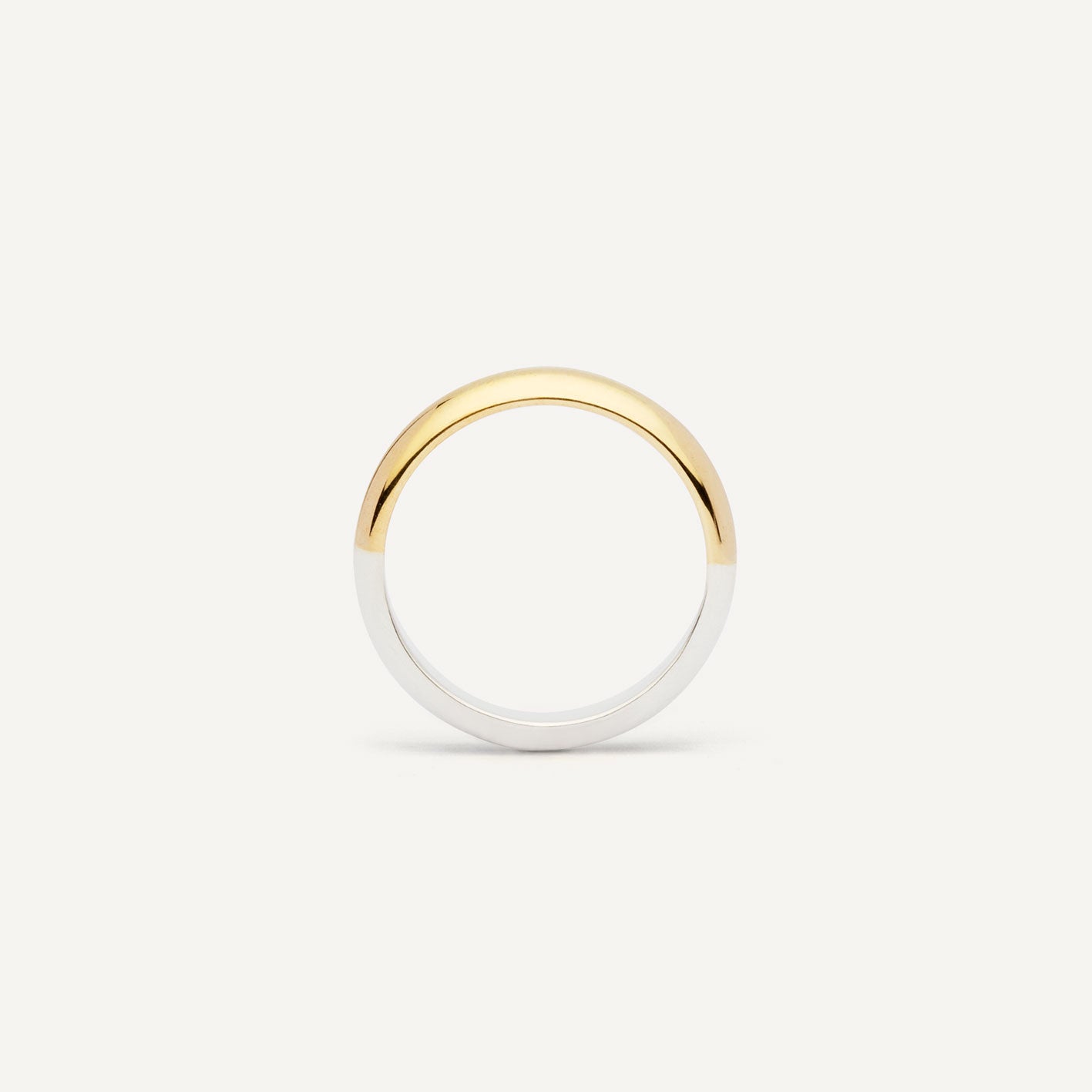 A wedding ring made out of 2 types of gold -18K Yellow and 18K White, symbolizing the union of two different people. Handmade jewelry piece. 