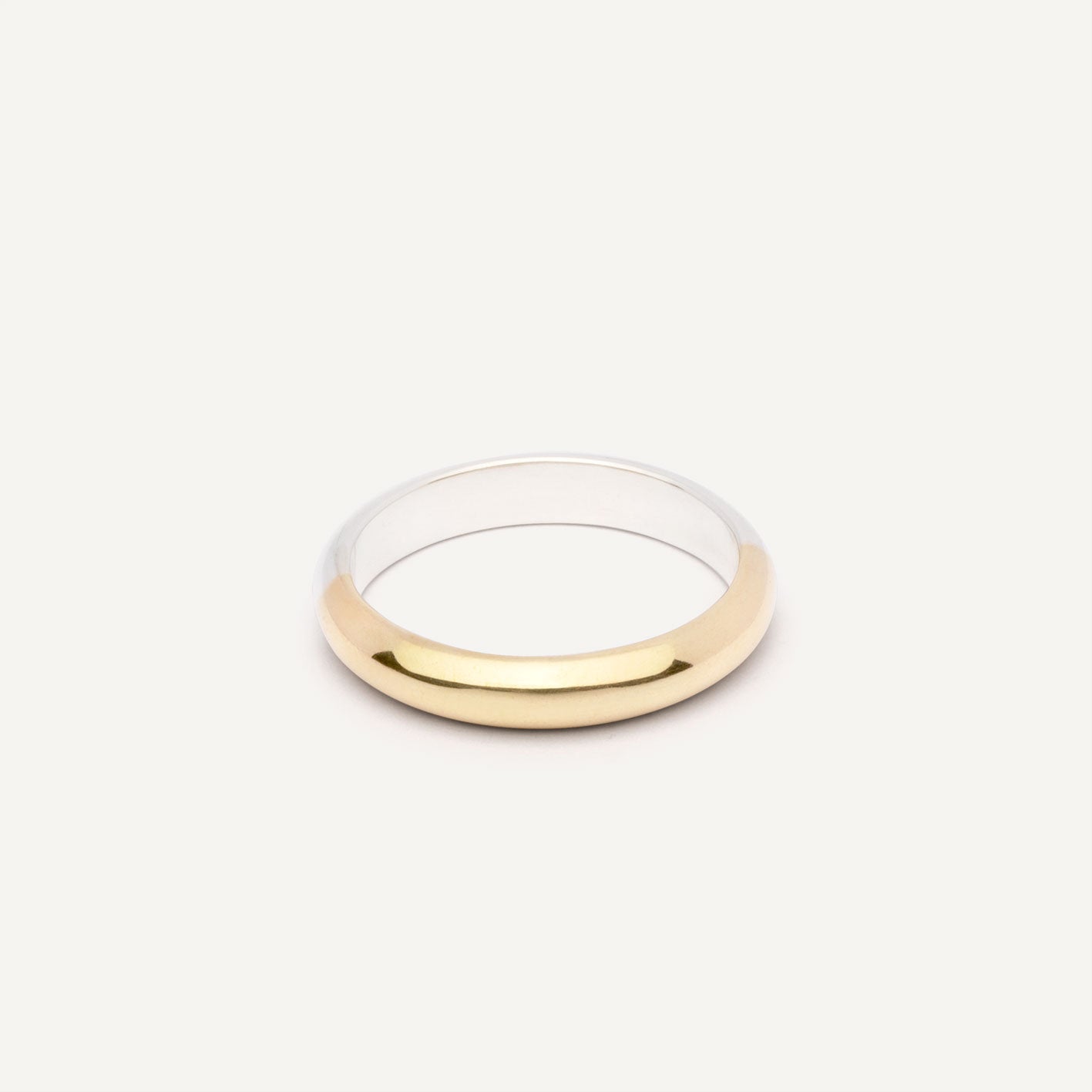 A wedding ring made out of 2 types of gold -18K Yellow and 18K White, symbolizing the union of two different people. Handmade jewelry piece. 
