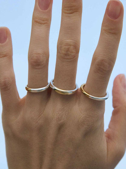 A wedding ring made out of 2 types of gold -18K Yellow and 18K White, symbolizing the union of two different people. Handmade jewelry piece. 