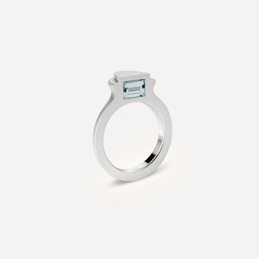 Silver signet ring with Blue Topaz on the side in 1 half of the ring.