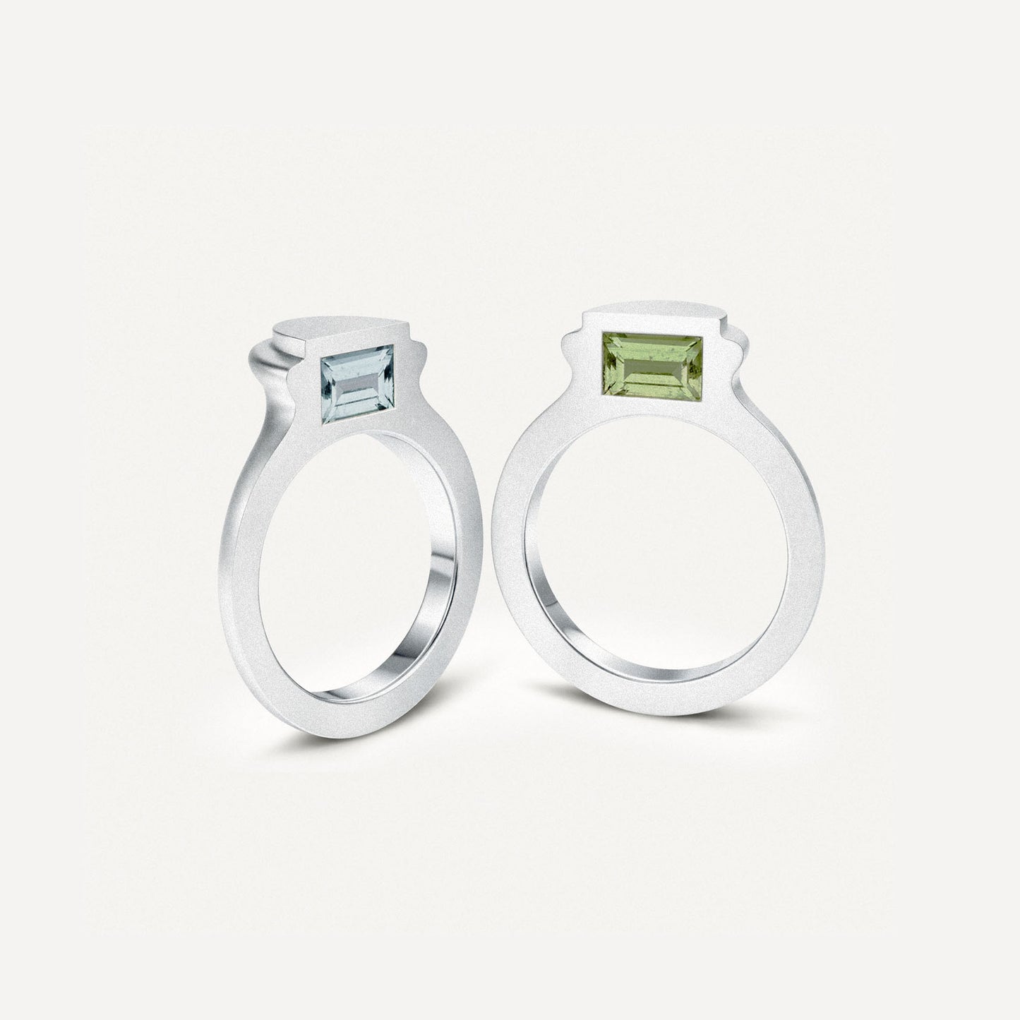 Silver signet ring with gemstones in 2 halves of the ring on the side.