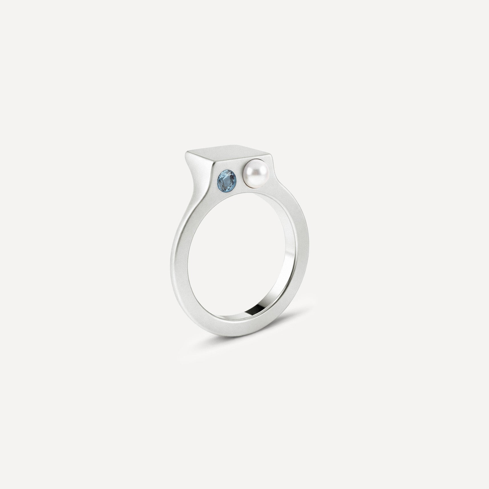 Silver signet open ring with a pearl and Blue Topaz on the side. 