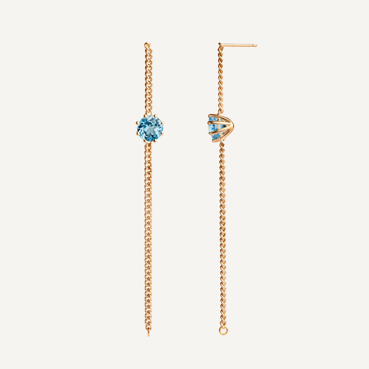 A pair of long chain earrings of blue Topaz gemstone made of 18k yellow gold plated silver. Handmade in Barcelona. 