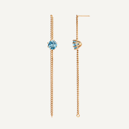 A pair of long chain earrings of blue Topaz gemstone made of 18k yellow gold plated silver. Handmade in Barcelona. 