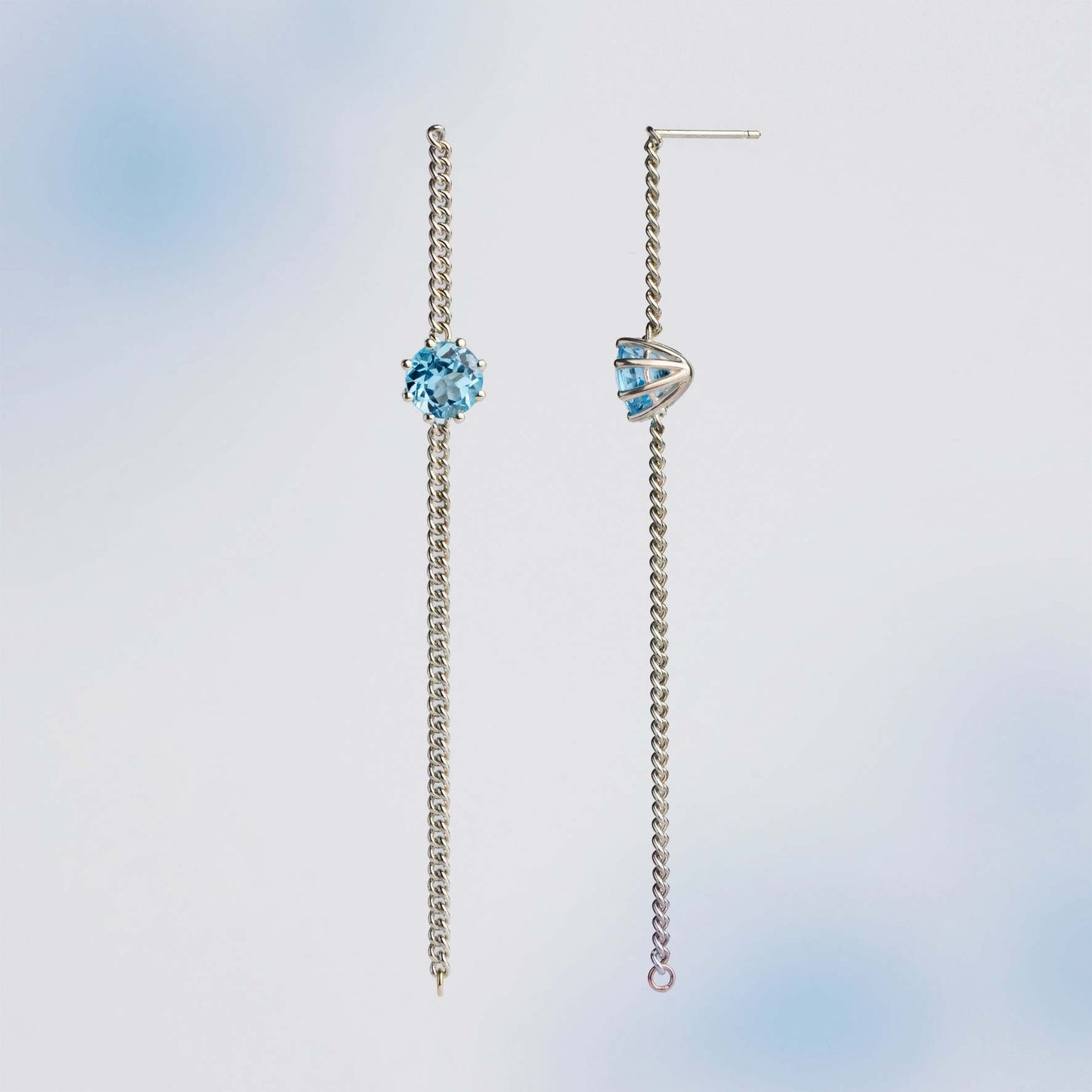 A pair of long chain earrings of Blue Topaz gemstone made of silver. Handmade in Barcelona. 