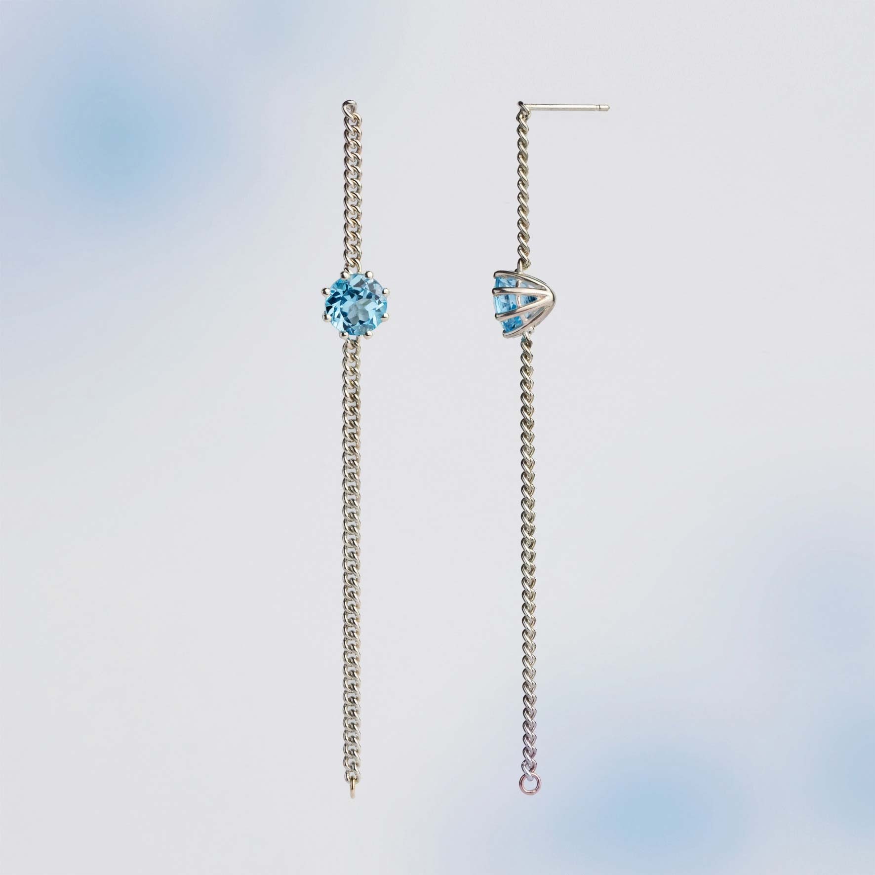A pair of long chain earrings of Blue Topaz gemstone made of silver. Handmade in Barcelona. 
