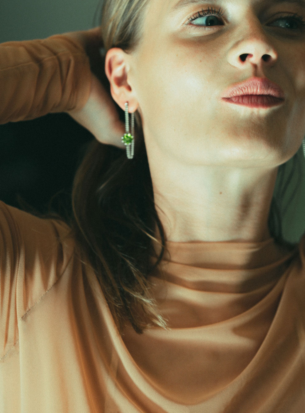 A pair of long chain earrings of colored gemstone made of silver. Handmade in Barcelona. 