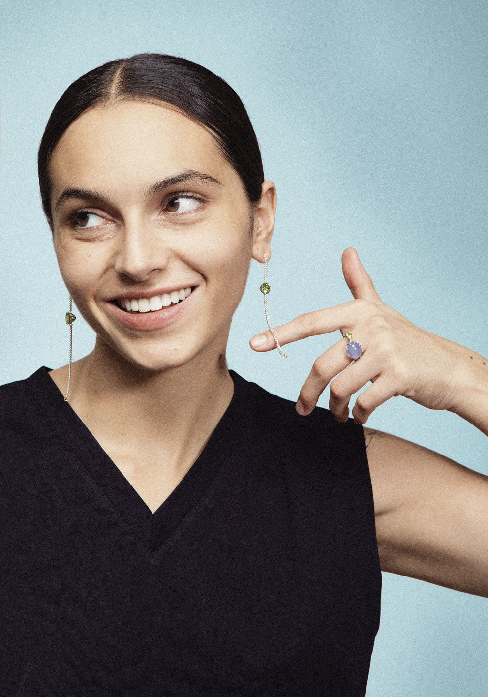 A pair of long chain earrings of colored gemstone made of silver. Handmade in Barcelona. 
