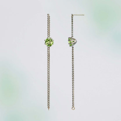 A pair of long chain earrings of green Peridot gemstone made of silver. Handmade in Barcelona. 