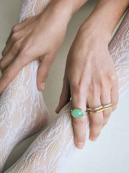 A silver ring with a double circle design for two fingers.