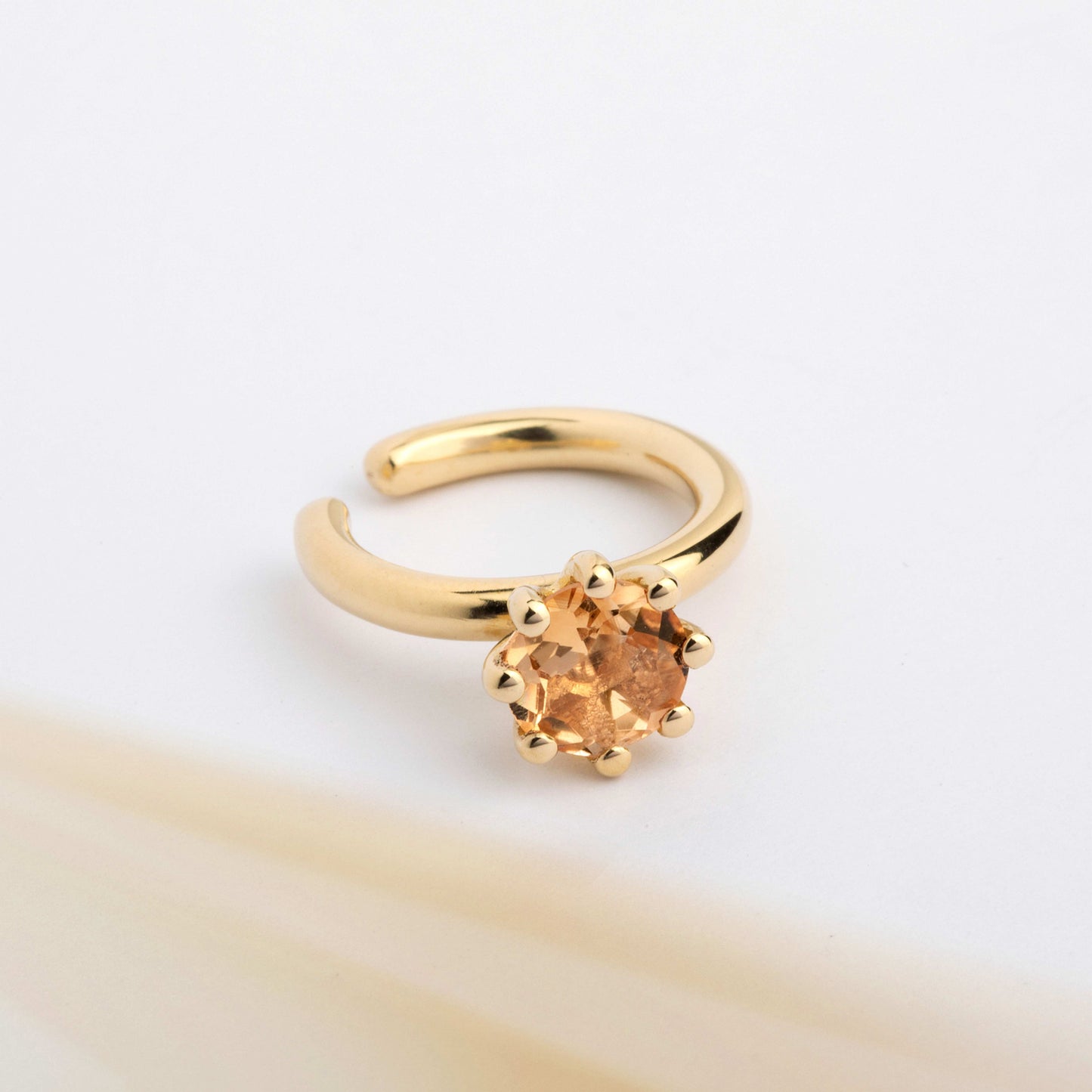 A ear cuff with yellow Citrine gemstone, made of 18k yellow gold plated silver. Handmade in Barcelona. No piercing needed. 