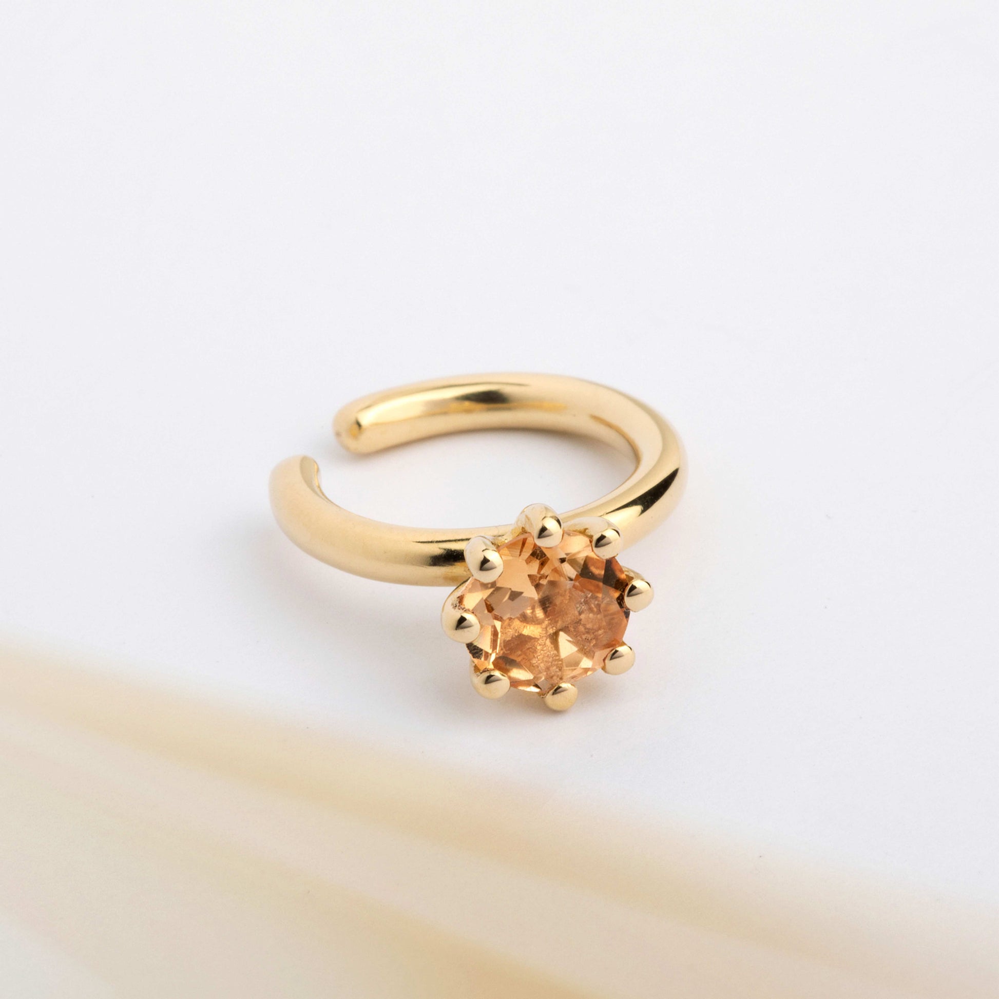 A ear cuff with yellow Citrine gemstone, made of 18k yellow gold plated silver. Handmade in Barcelona. No piercing needed. 