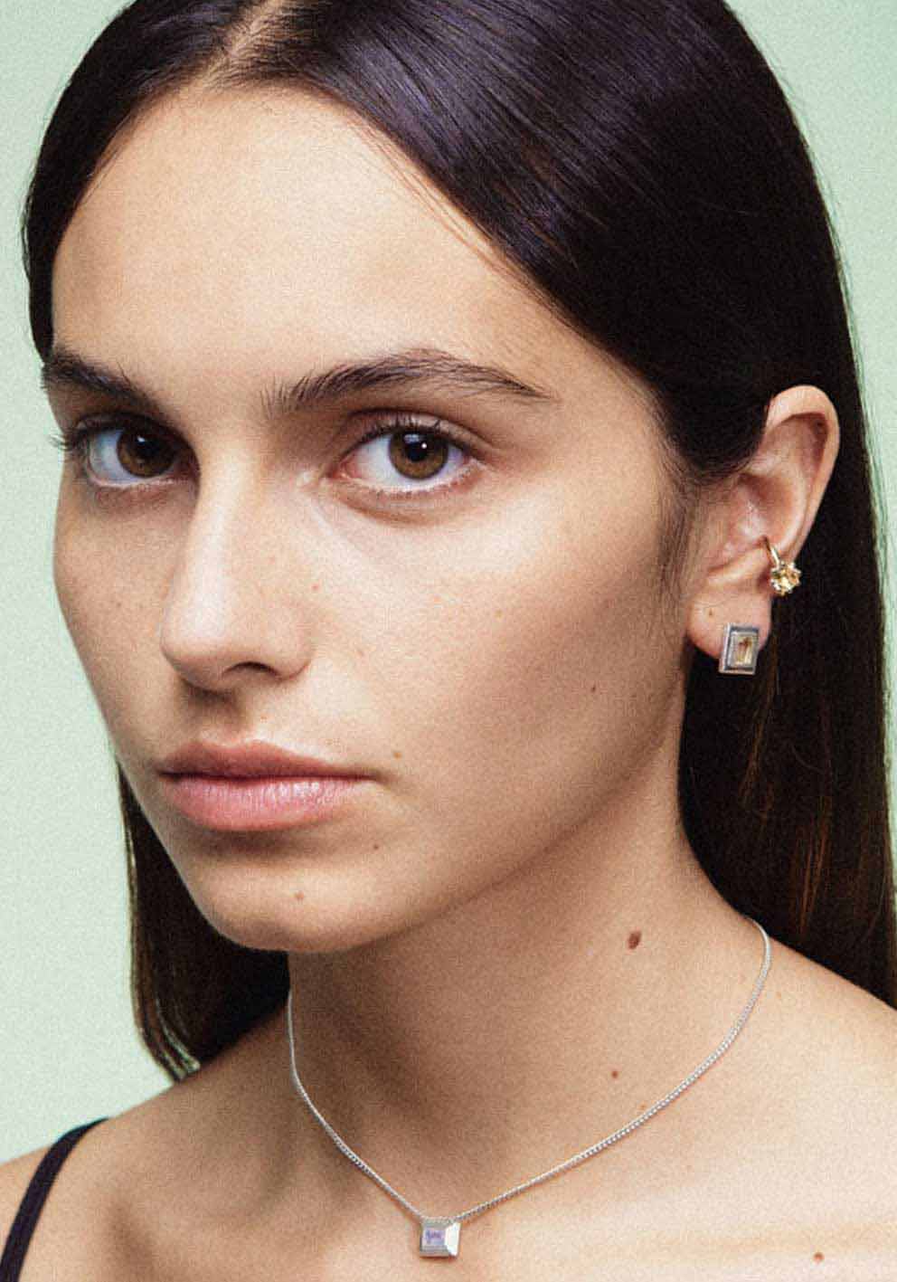 An ear cuff with a gemstone, made of silver. Handmade in Barcelona. No piercing needed. 