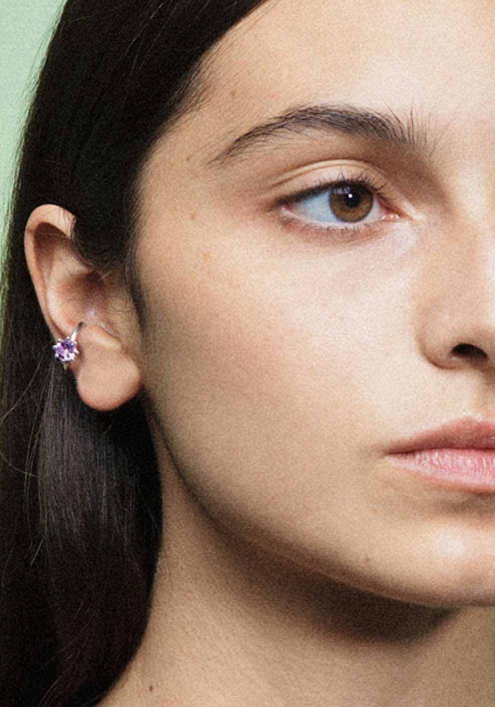 An ear cuff with a gemstone, made of silver. Handmade in Barcelona. No piercing needed. 