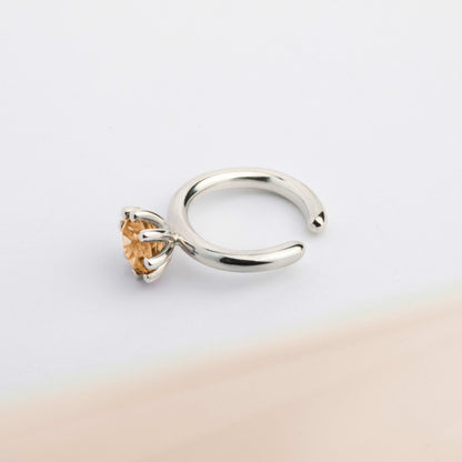 A ear cuff with yellow Citrine gemstone, made of silver. Handmade in Barcelona. No piercing needed. 