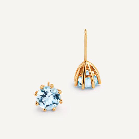 A pair of 18k yellow gold plated silver earrings featuring Blue Topaz, designed for everyday wear. Handmade in Barcelona. 