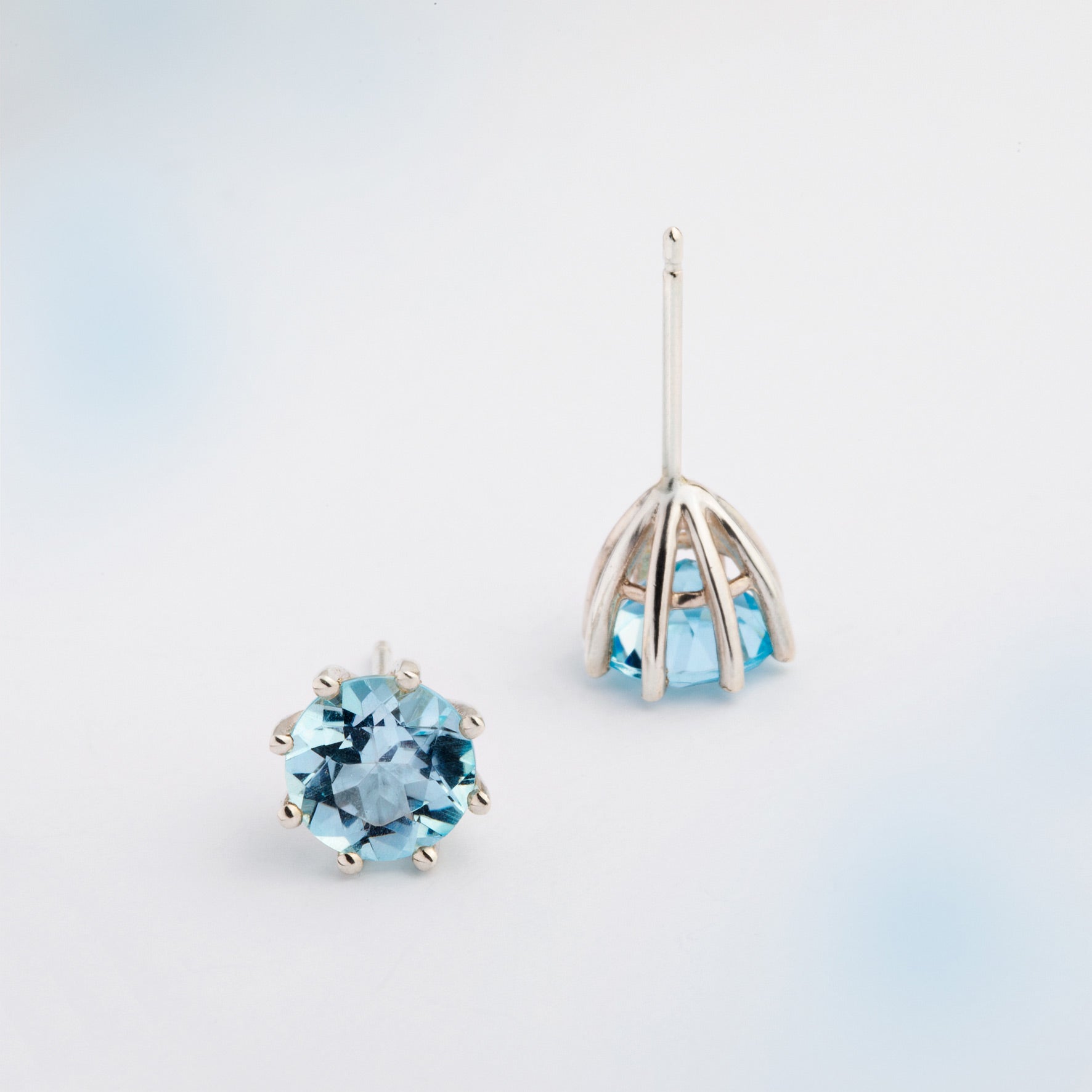 A pair of silver earrings featuring Blue Topaz, designed to be worn every day. Handmade in Barcelona. 