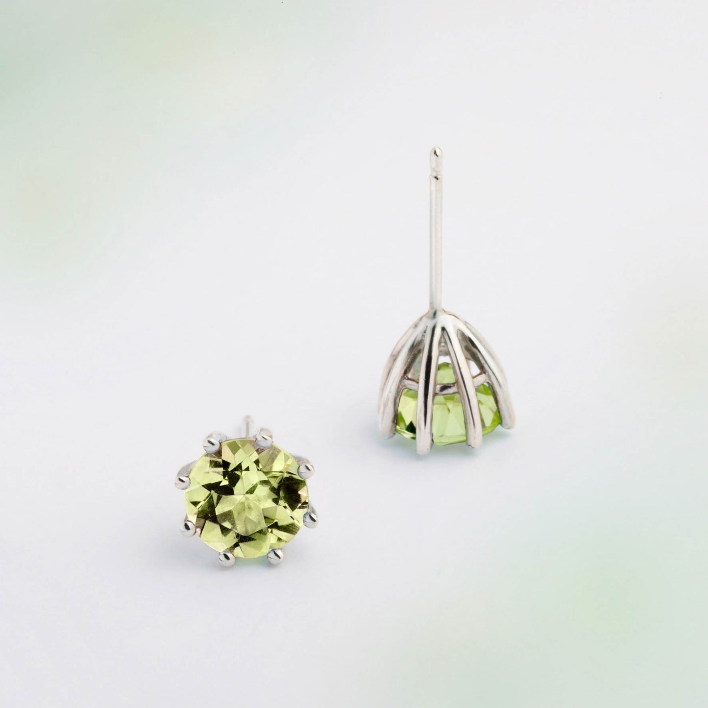A pair of silver earrings featuring Green Peridot gemstone, designed for everyday wear. Handmade in Barcelona. 