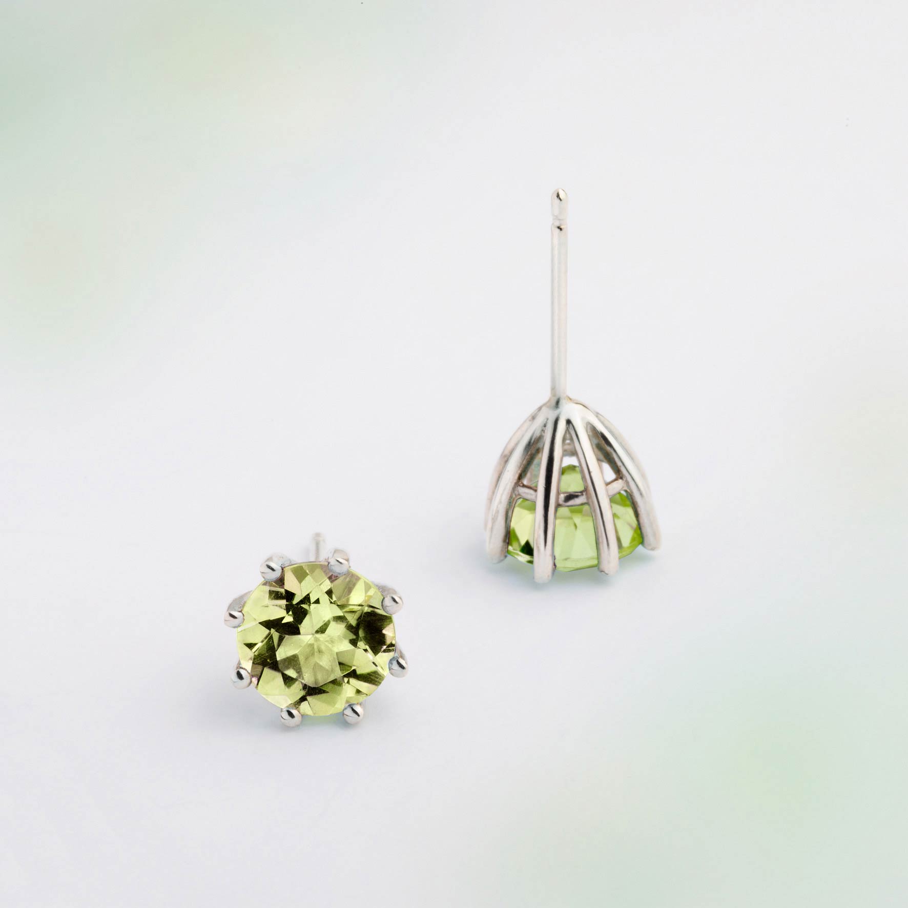 A pair of silver earrings featuring Green Peridot gemstone, designed for everyday wear. Handmade in Barcelona. 