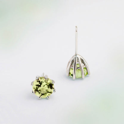 A pair of silver earrings featuring Green Peridot gemstone, designed for everyday wear. Handmade in Barcelona. 