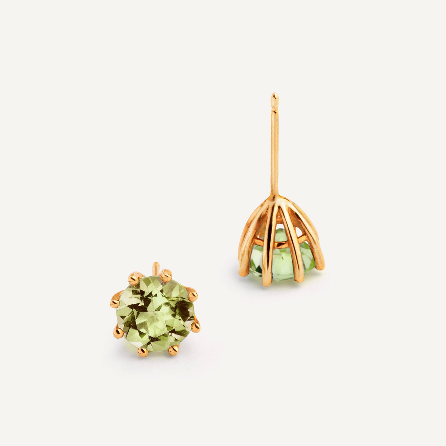 A pair of gold plated silver earrings featuring green Peridot, designed for everyday wear. Handmade in Barcelona. 