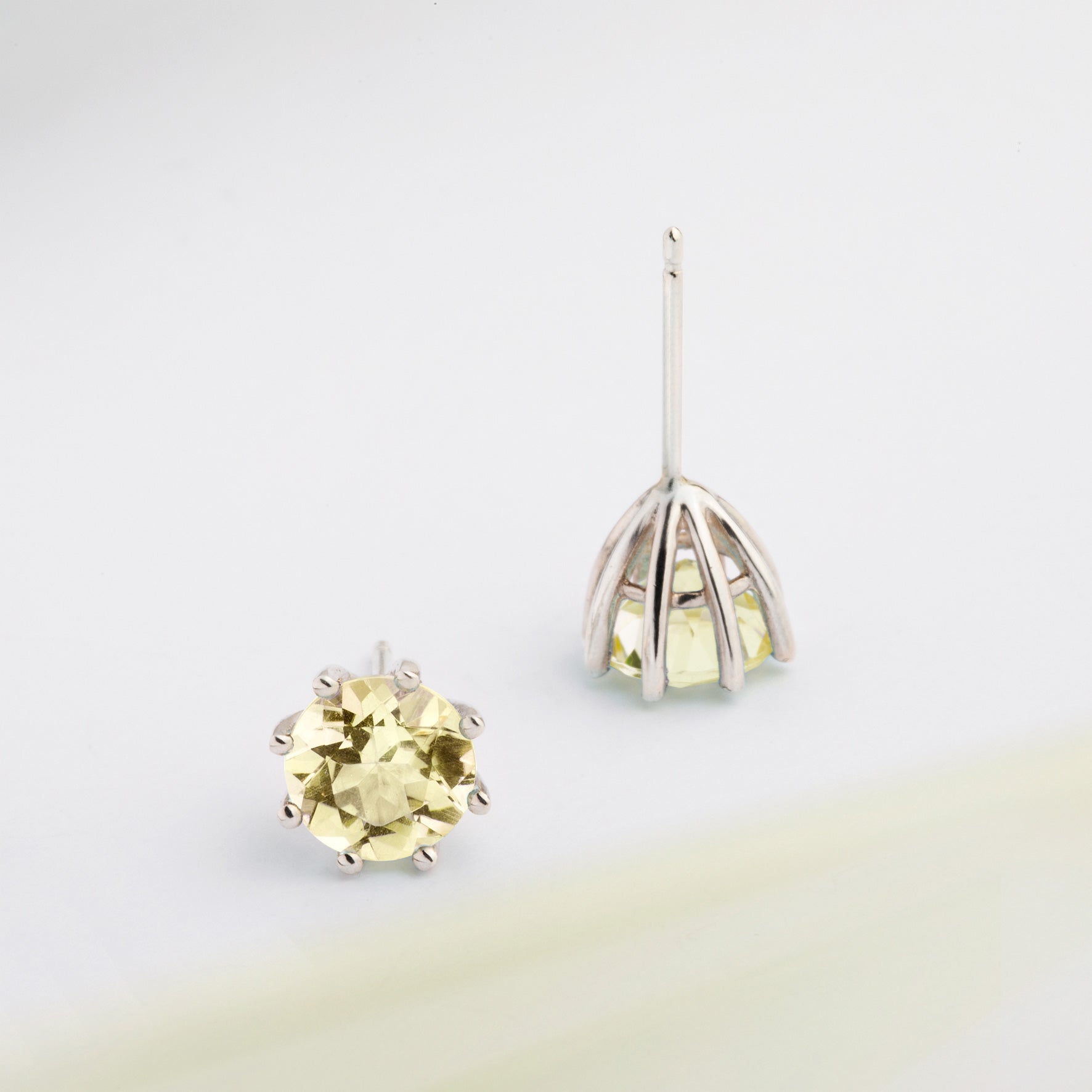 A pair of silver earrings featuring Lemon Citrine, designed to be worn every day. Handmade in Barcelona. 