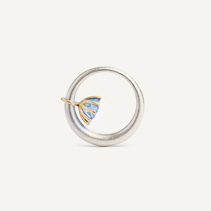 I wanted to make a playful silver ring using a combination of metals — a setting that doesn’t sit still. Here it is: an 18K gold setting with a gemstone that moves along the ring as you move your hand. 