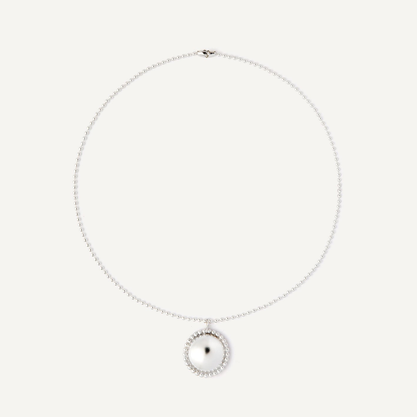 Silver half-sphere necklace designed to be worn every day. Handmade in Barcelona.