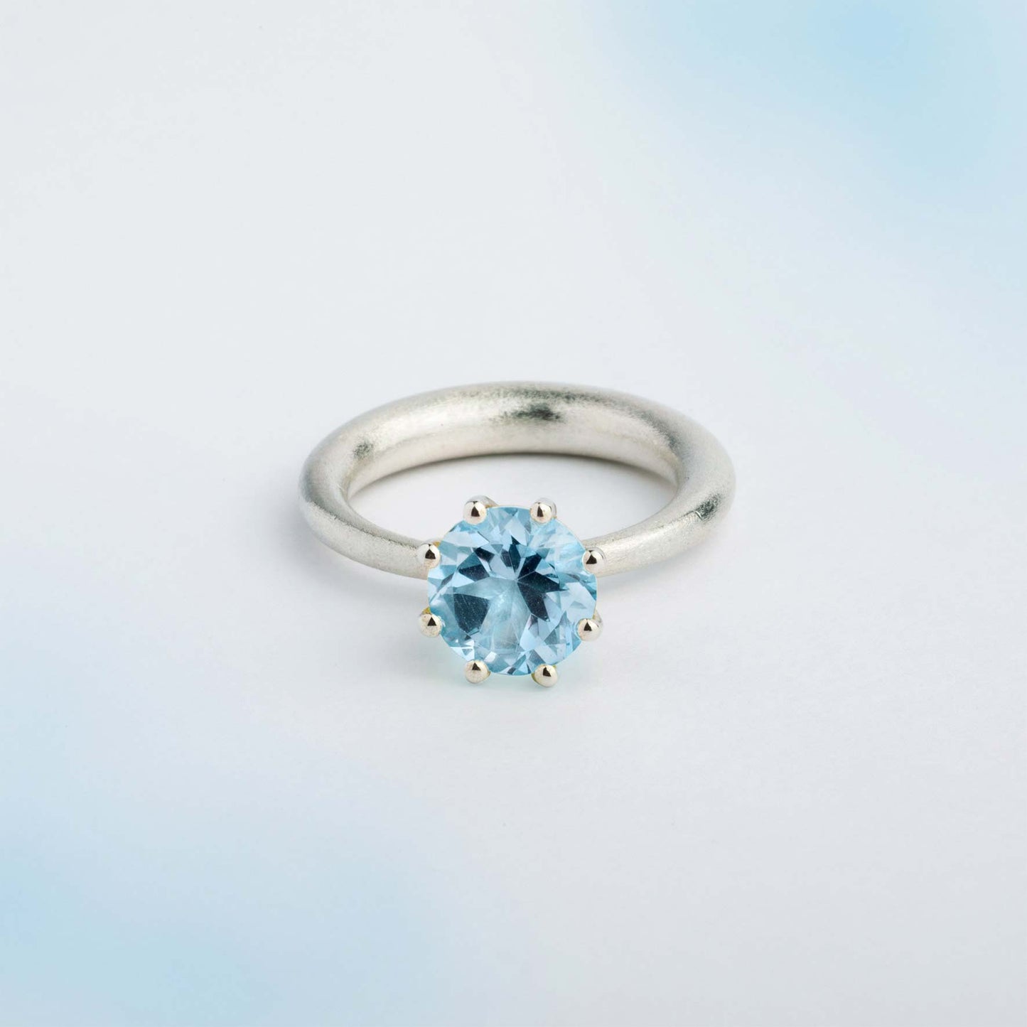 I wanted to create a silver ring with a surprise — and here it is: the setting with blue Topaz gemstone isn’t fixed to the ring. It moves along as you move your hand, quietly, almost with its own small rhythm. 