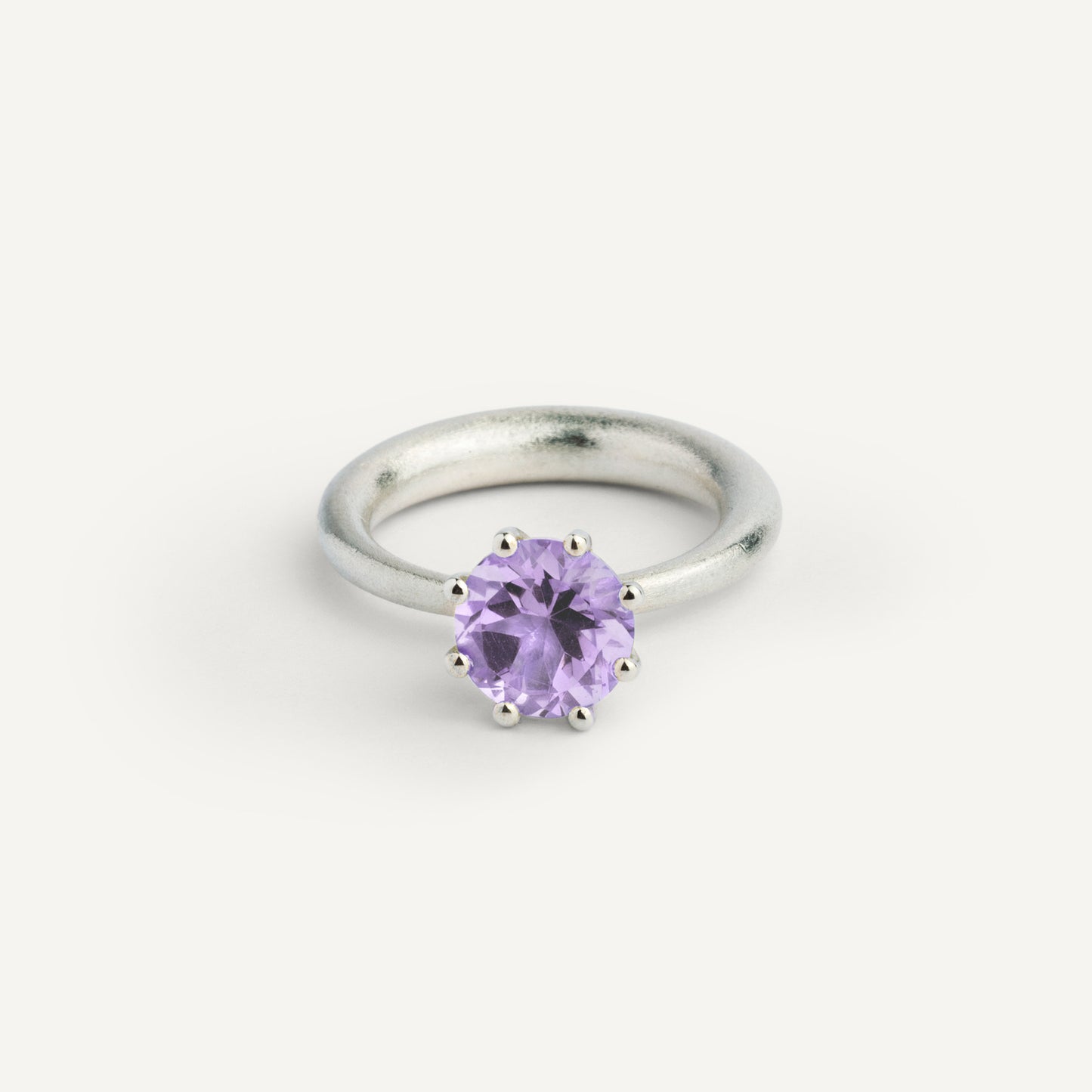 I wanted to create a silver ring with a surprise — and here it is: the setting with violet Amethyst gemstone isn’t fixed to the ring. It moves along as you move your hand, quietly, almost with its own small rhythm. 