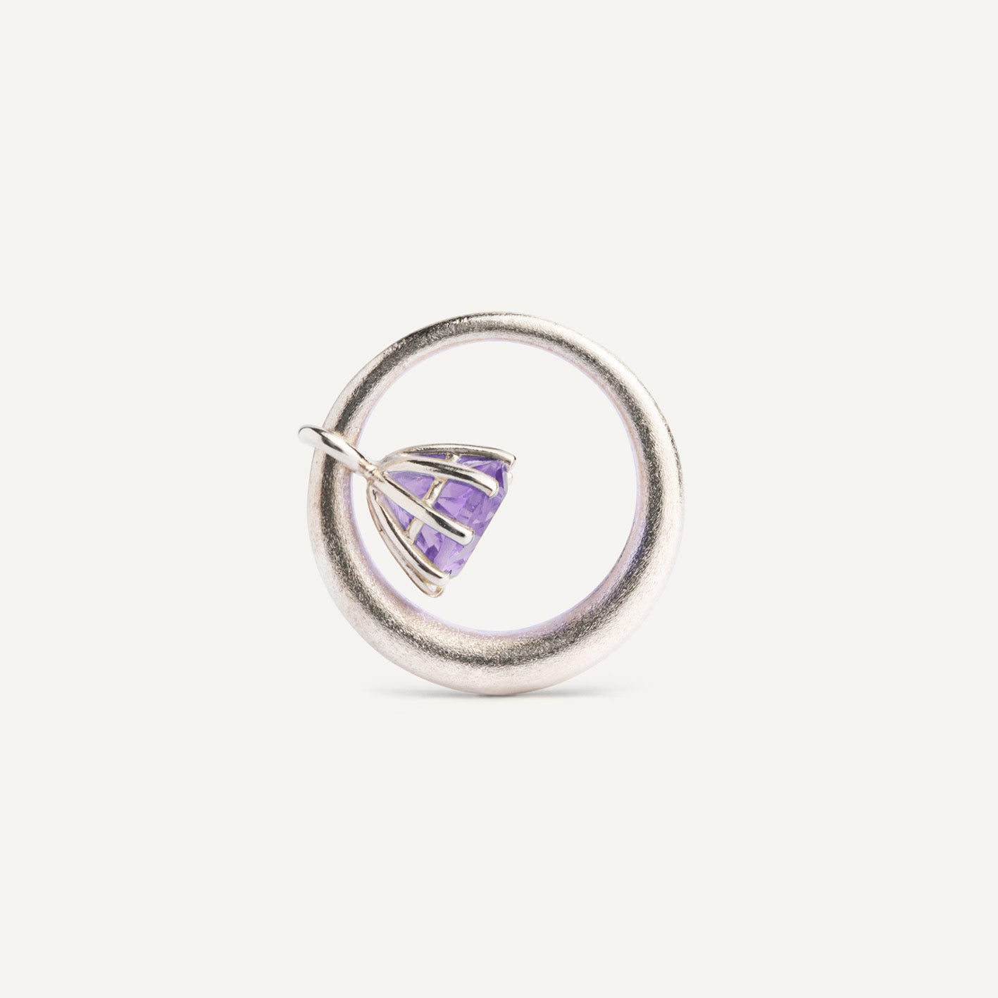 I wanted to create a silver ring with a surprise — and here it is: the setting with violet Amethyst gemstone isn’t fixed to the ring. It moves along as you move your hand, quietly, almost with its own small rhythm. 