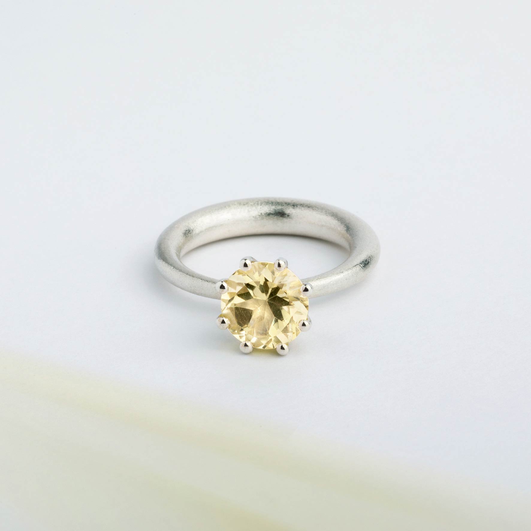 I wanted to create a silver ring with a surprise — and here it is: the setting with yellow Citrine gemstone isn’t fixed to the ring. It moves along as you move your hand, quietly, almost with its own small rhythm. 