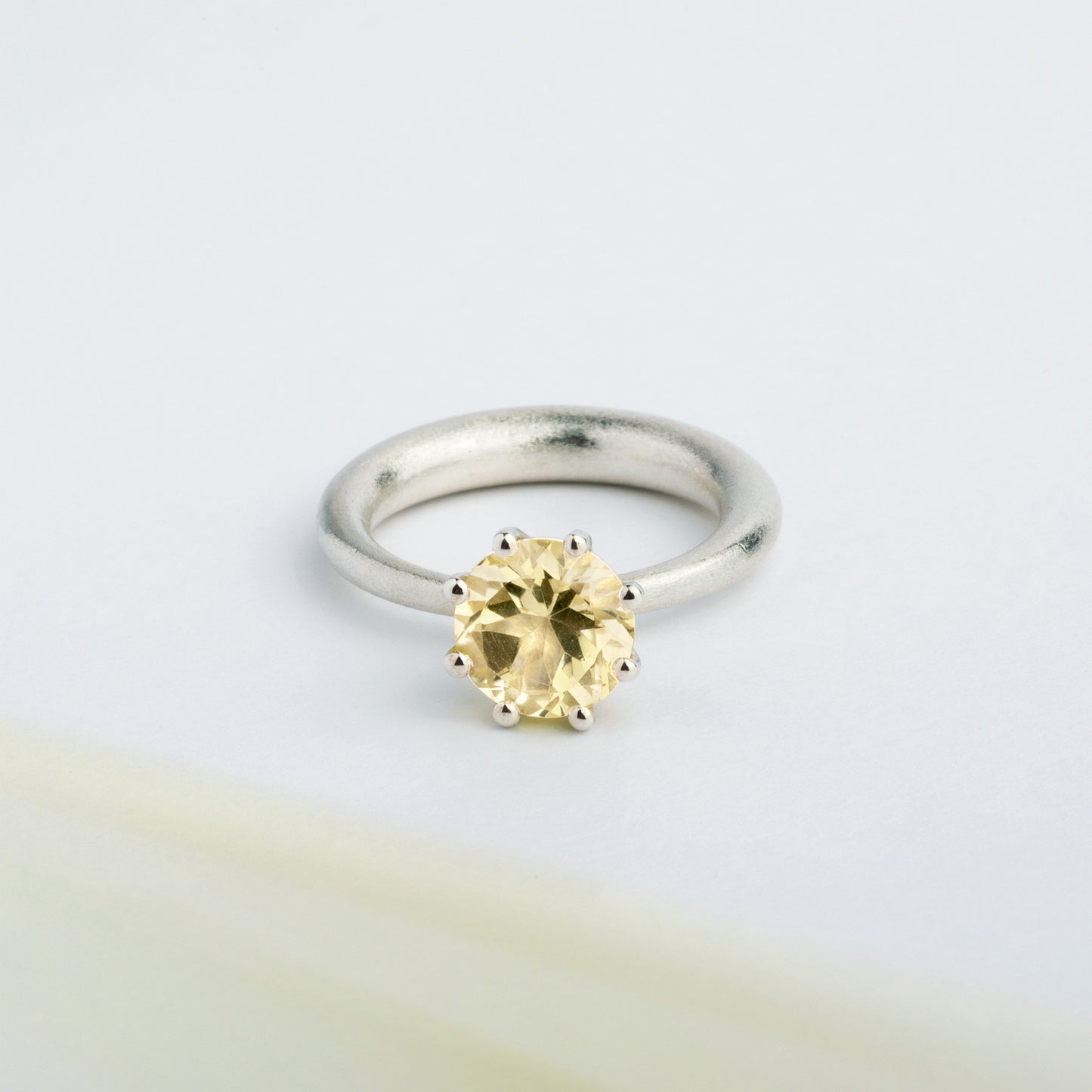 I wanted to create a silver ring with a surprise — and here it is: the setting with yellow Citrine gemstone isn’t fixed to the ring. It moves along as you move your hand, quietly, almost with its own small rhythm. 